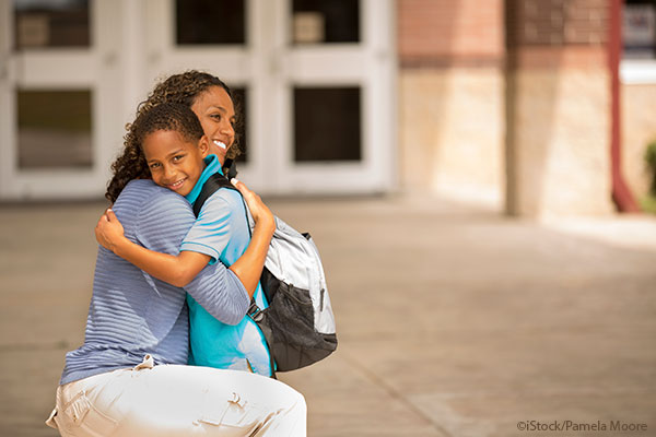 mom hugging son