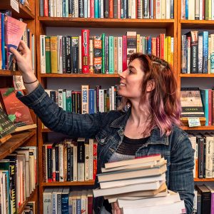 person shelving books