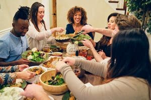 Friends enjoying thanksgiving dinner